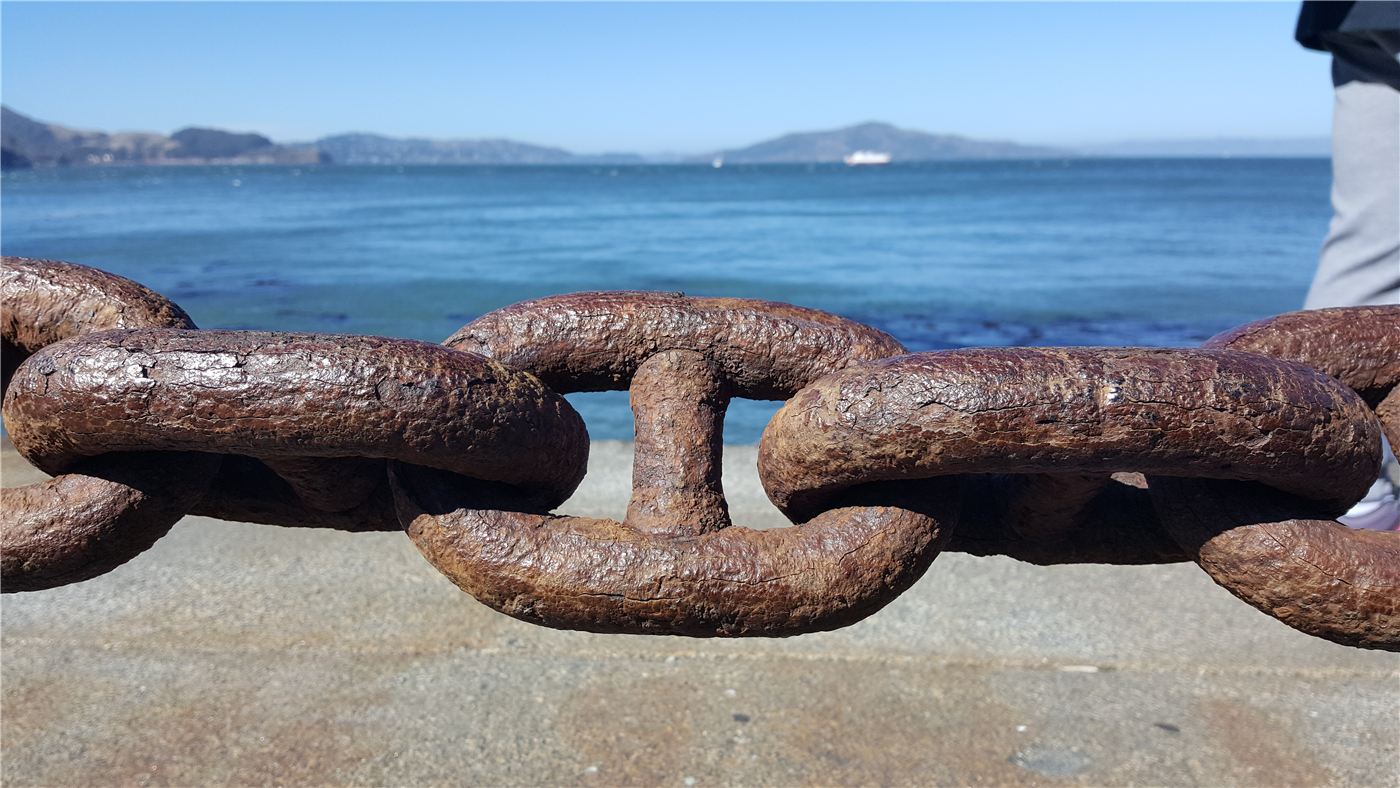 Heavy chain links by the sea