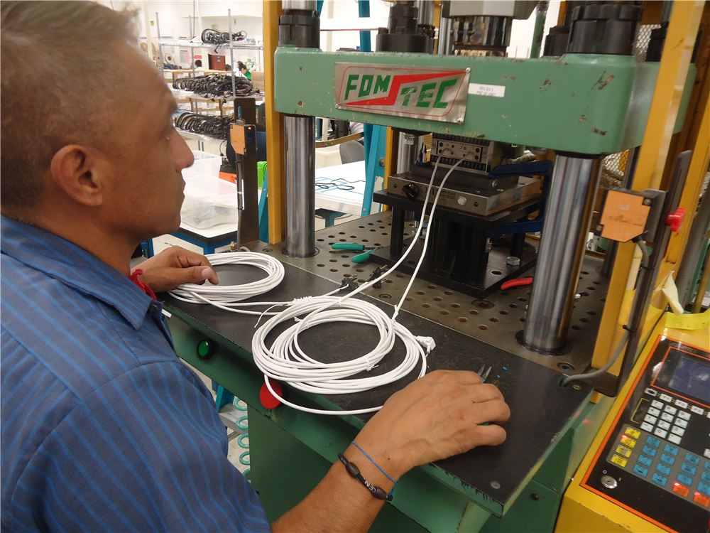 Operator running a hydraulic press